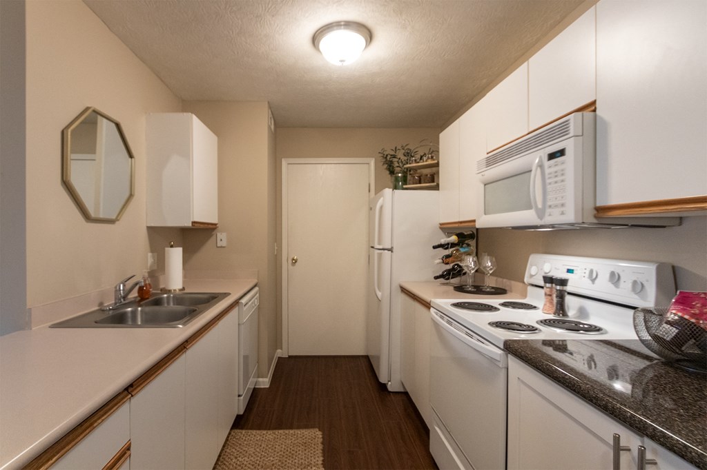 This is a photo of the kitchen of the 890 square foot 2 bedroom, 2 bath Liberty at Washington Place Apartments in in Miamisburg, Ohio in Washington Township.