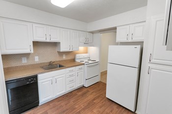 This is a photo of the kitchen in the 751 square foot 1 bedroom, 1 bath apartment at Woodbridge Apartments in Dallas, TX. - Photo Gallery 2