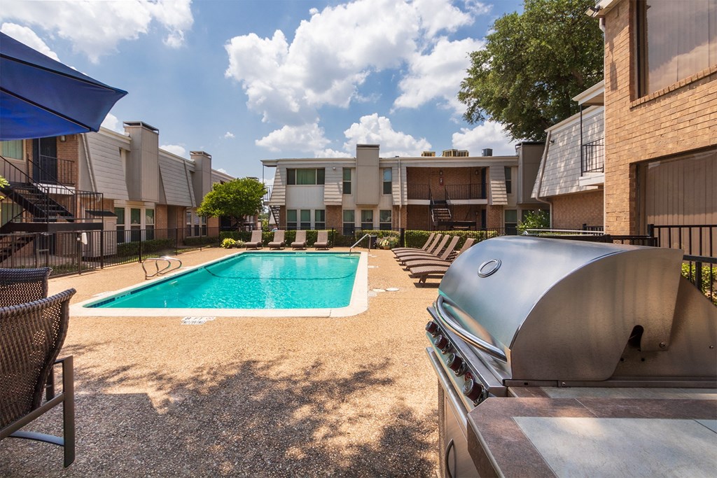 This is a photo of the pool area at Woodbridge Apartments in Dallas, Texas.