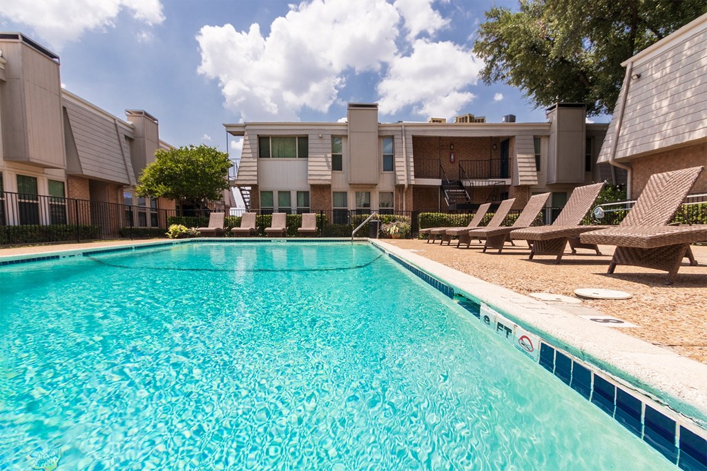 This is a photo of the pool area at Woodbridge Apartments in Dallas, Texas.