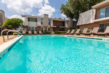 This is a photo of the pool area at Woodbridge Apartments in Dallas, Texas.