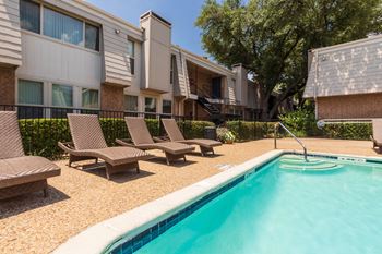 This is a photo of the pool area at Woodbridge Apartments in Dallas, Texas.