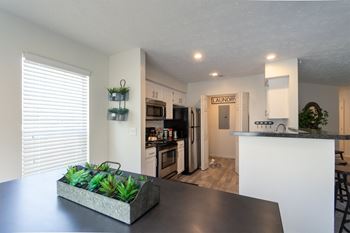 This is a photo of the kitchen of the 1100 square foot 2 bedroom Kettering floor plan at Washington Park Apartments in Centerville, OH.