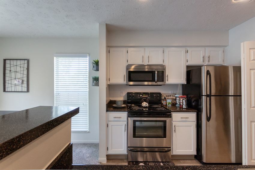This is a photo of the kitchen of the 1100 square foot 2 bedroom Kettering floor plan at Washington Park Apartments in Centerville, OH. - Photo Gallery