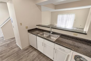 This is a photo of the kitchen of the 1280 square foot 2 bedroom, 2 and 1/2 bath Oakwood floor plan at Washington Park Apartments in Centerville, OH. - Photo Gallery 4