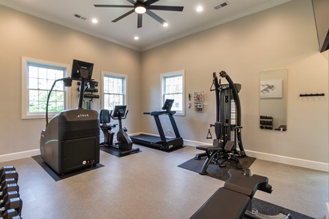 The 24-hour fitness center with treadmill, cycling machine, stair stepper, yoga mats and free weights at Washington Park Apartments, in Centerville, OH.