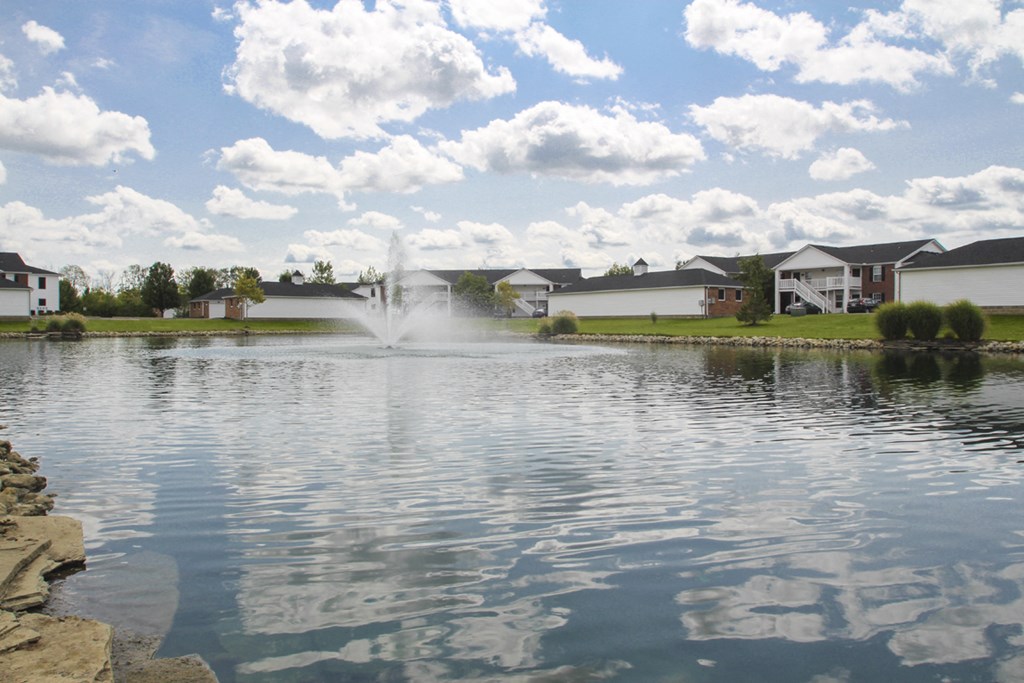 This is a photo of a fountain in a pond at Washington Place Apartments in Washington Township, OH