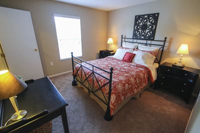 This is a photo of the master bedroom of the 890 square foot 2 bedroom Liberty at Washington Place Apartments in Centerville, OH.