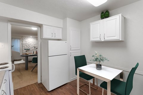 This is a photo of a virtually staged kitchen in the 751 square foot 1 bedroom, 1 bath apartment with fireplace at Woodbridge Apartments in Dallas, TX.