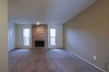 This is a photo of the fireplace in the living room of the 751 square foot 1 bedroom apartment at Woodbridge Apartments in Dallas, TX.