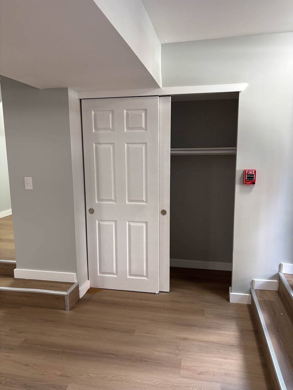 A white door is in a room with wooden floors.at Lawndale Apartments, Philadelphia, PA 19111