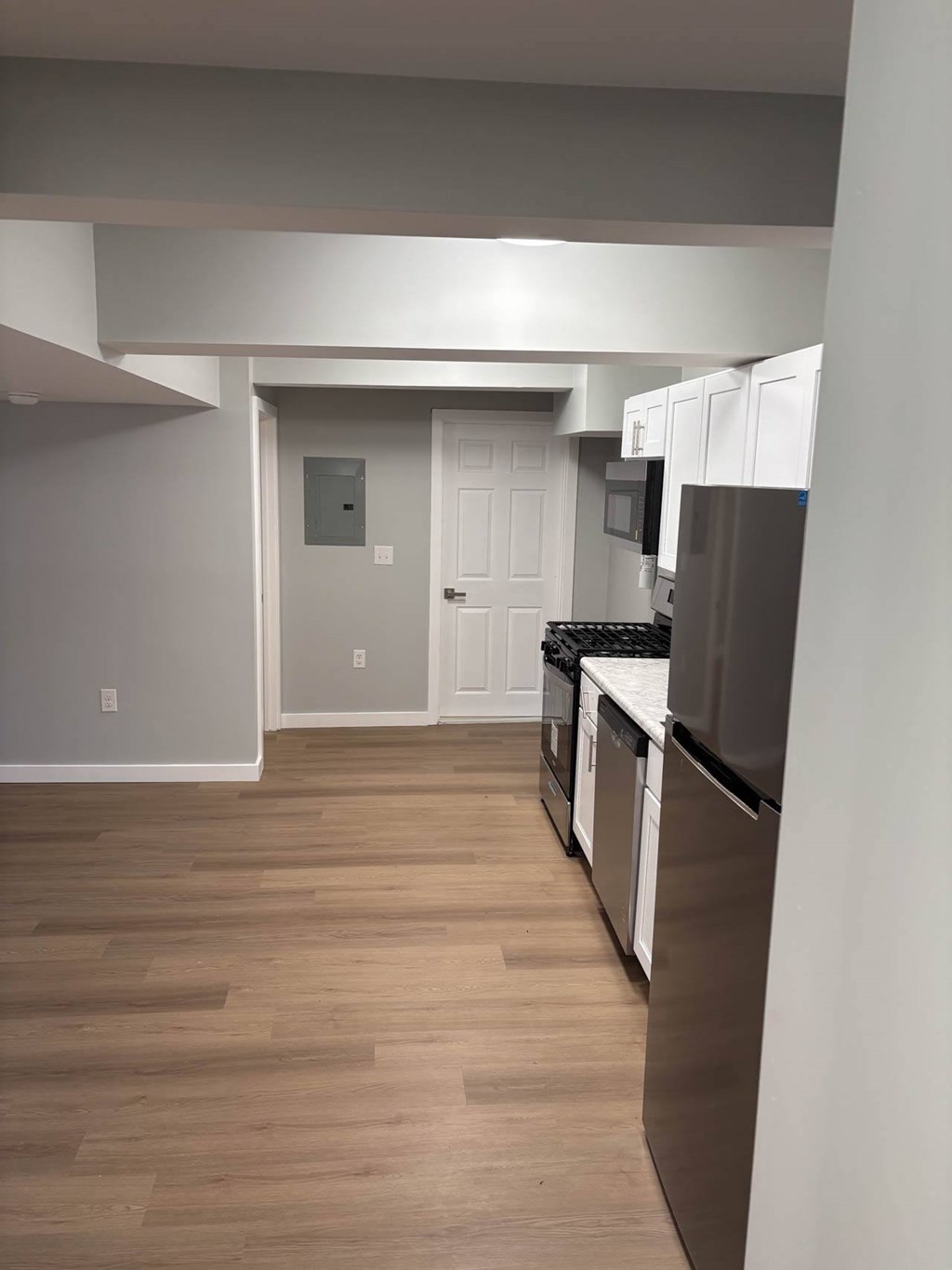 A kitchen with white cabinets and stainless steel appliances.at Lawndale Apartments, Philadelphia, PA