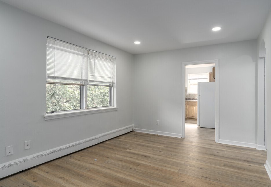 A room with a window and wooden floors.at Lawndale Apartments, Philadelphia, PA 19111
