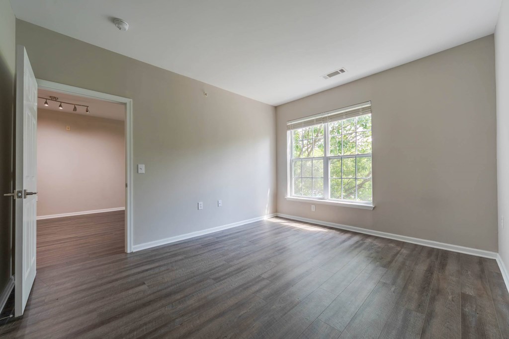 A room with a wooden floor and a window.at Riverview Landing @ Valley Forge, Pennsylvania