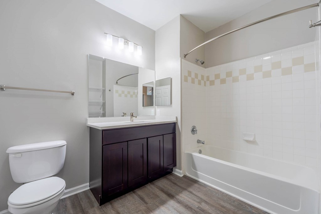 A white toilet sits next to a sink in a bathroom.at Riverview Landing @ Valley Forge, Eagleville, PA 19403