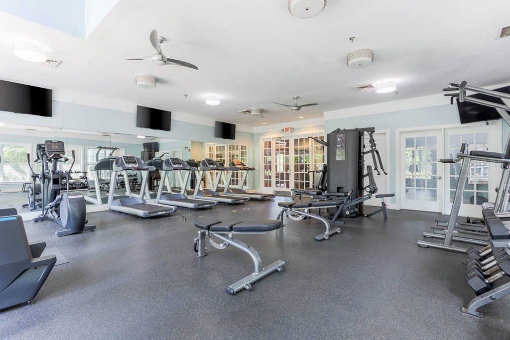 A spacious gym with a variety of equipment including treadmills, elliptical machines, and weight machines.at Riverview Landing @ Valley Forge, Eagleville, PA 19403