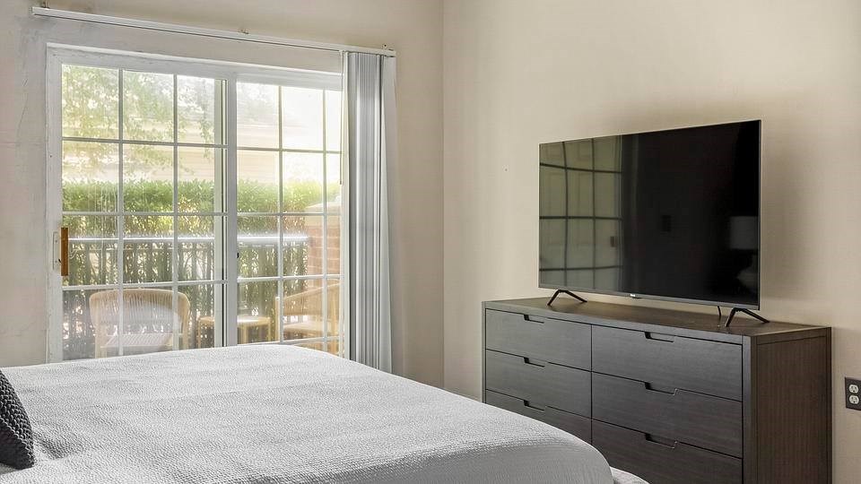 Bedroom With TV at Riverview Landing @ Valley Forge, Eagleville, PA