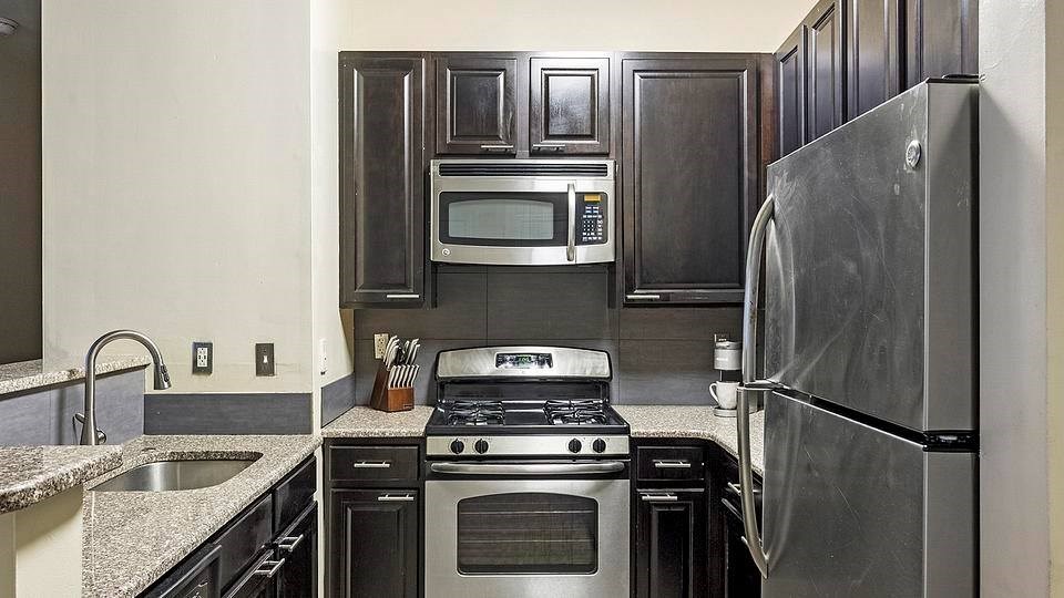 A modern kitchen with a stainless steel refrigerator, oven, and microwave.at Riverview Landing @ Valley Forge, Pennsylvania, 19403