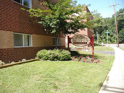 a brick building with a sign on the side of it