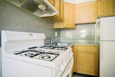 a kitchen with a stove and a sink a kitchen with a stove and a sink at Krewstown Park Apartments, Philadelphia