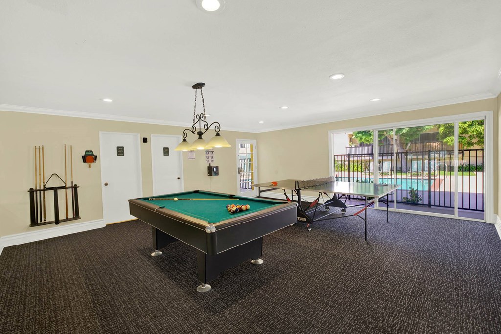 a game room with a pool table and a ping pong table at Casa De Oro Apartments, Torrance, CA 90505