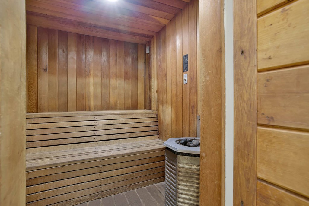 a sauna in a wooden room with a garbage can at Casa De Oro Apartments, Torrance, 90505