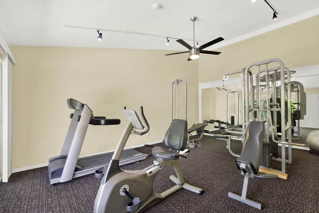 a gym with various exercise equipment on the floor at Casa De Oro Apartments, California, 90505