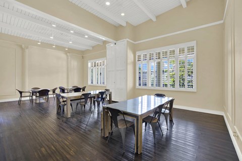 a dining room with a table and chairs a dining room with a table and chairs at Willow Tree Apartments, Torrance