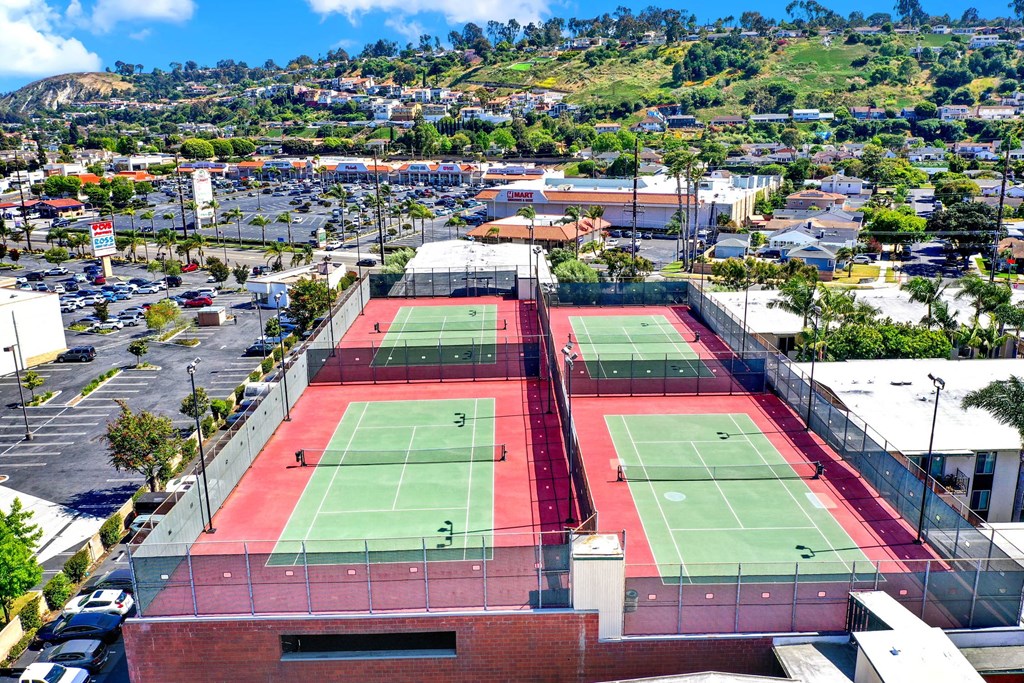 a view of the tennis courts on the roof of a building at Willow Tree Apartments, California, 90505