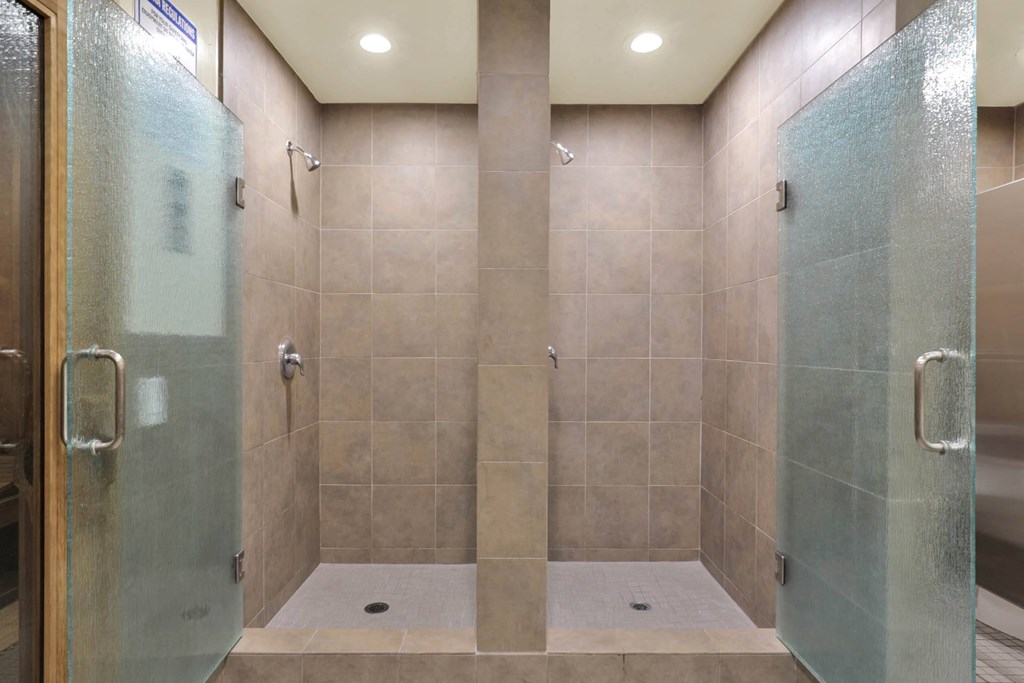 a large shower with two glass doors in a bathroom at Willow Tree Apartments, Torrance, CA, 90505
