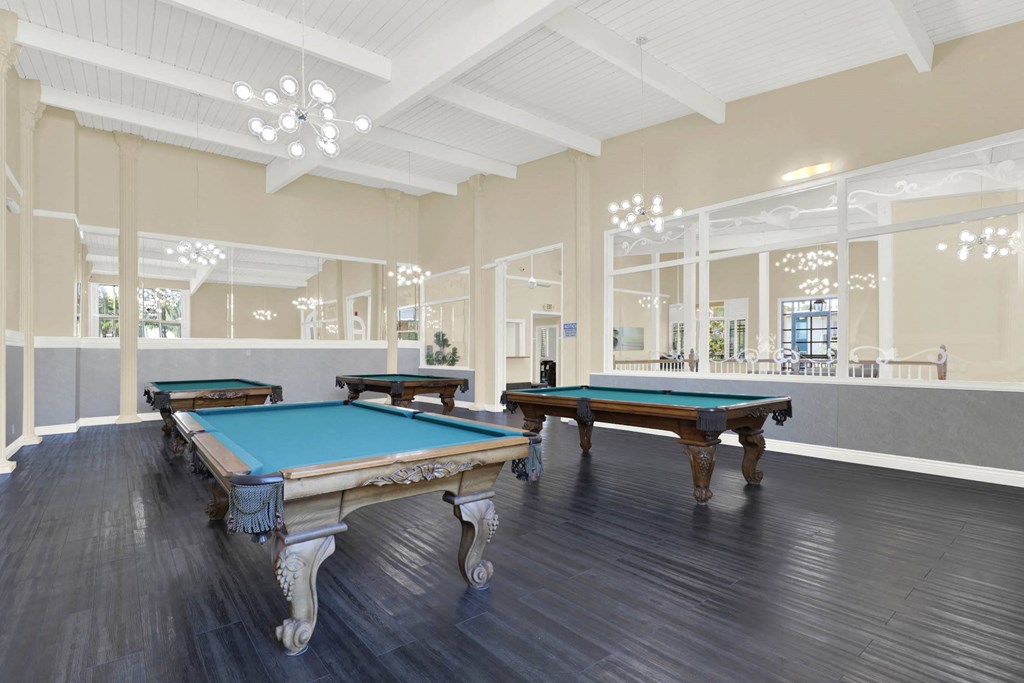 two pool tables in a large room with windows at Willow Tree Apartments, Torrance, CA, 90505