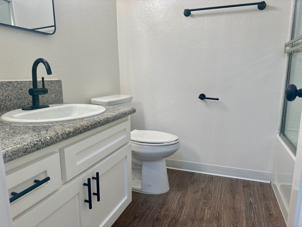 a bathroom with a toilet and a sink and a shower at Camino de Oro Apartments, Torrance, CA, 90505