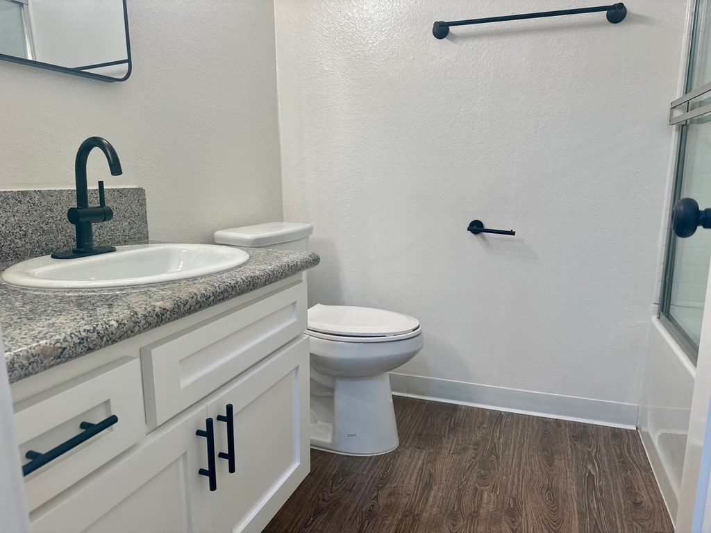 a bathroom with a toilet and a sink and a shower at Willow Tree Apartments, California, 90505
