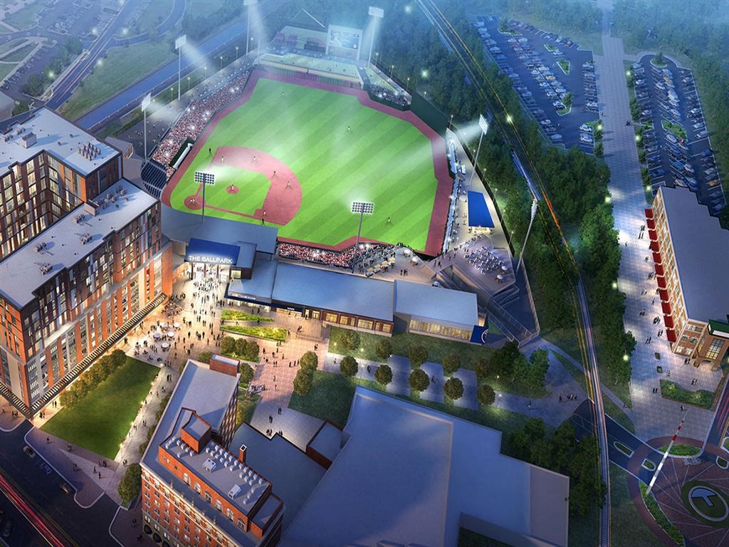 A rendering of a baseball stadium with a green field and a crowd of spectators.