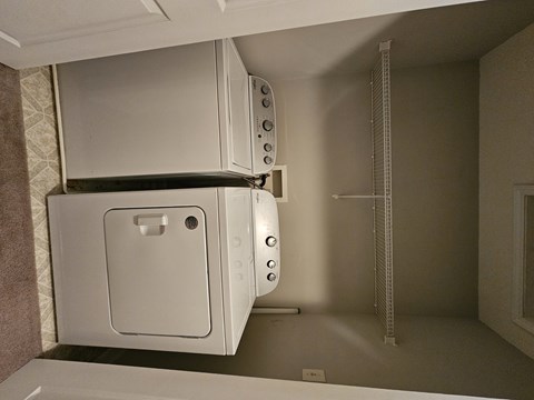 A white oven and microwave in a kitchen.