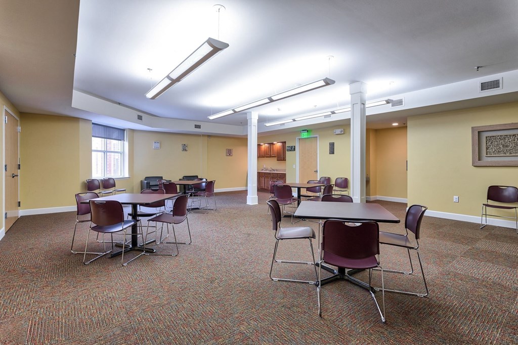 a large room with tables and chairs