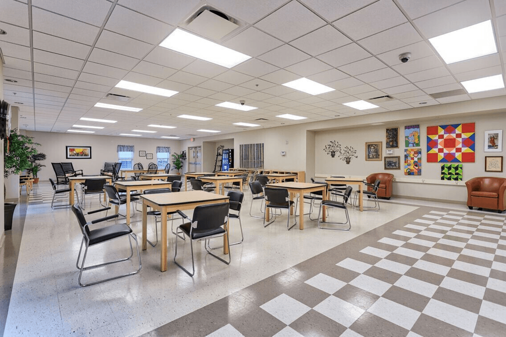 a dining room with tables and chairs and a checkered floor