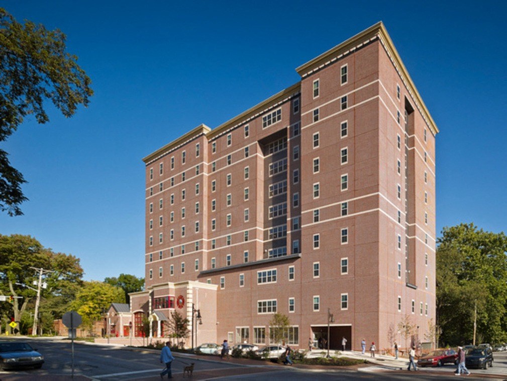 a large brick building on the corner of a street
