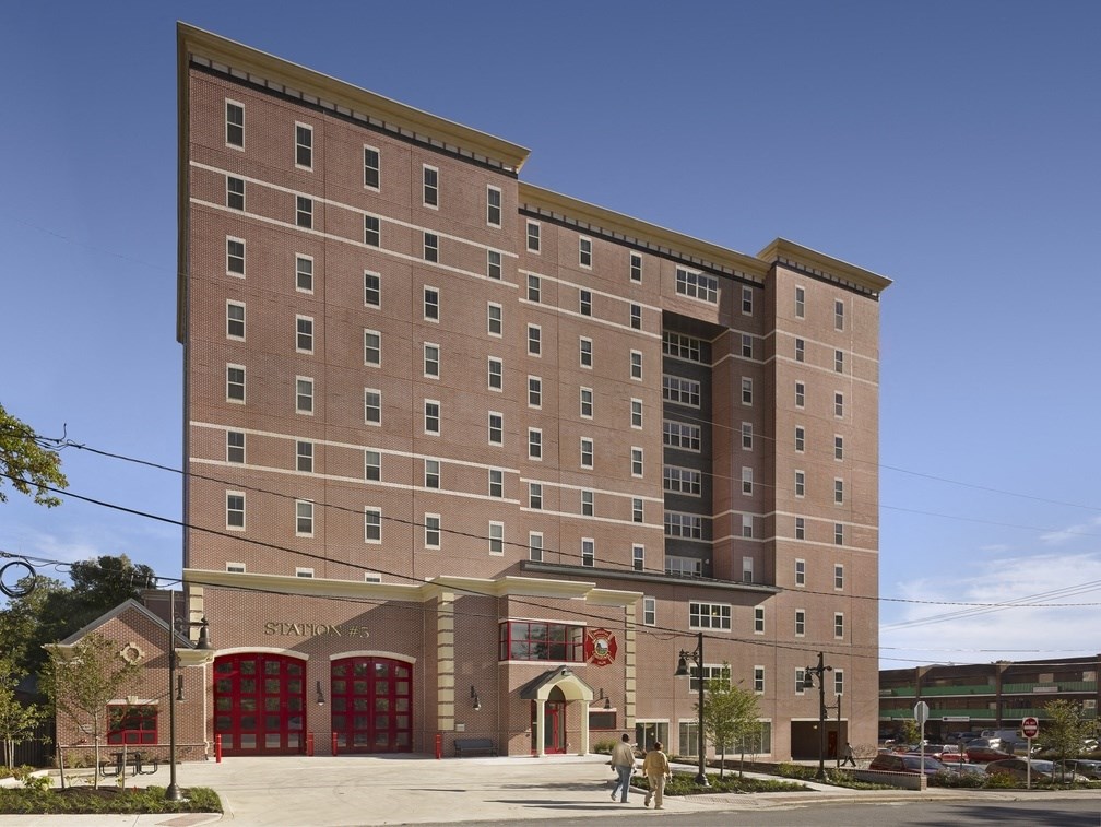 a large brick building on the corner of a street