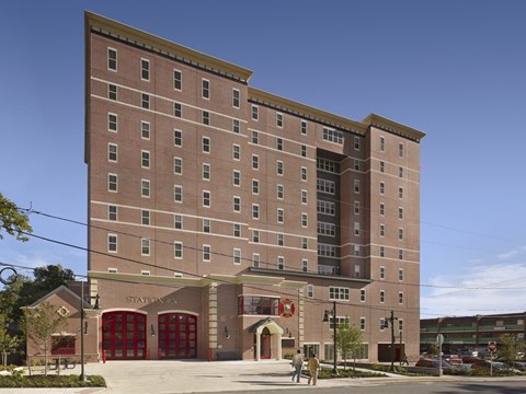 a large brick building on the corner of a street