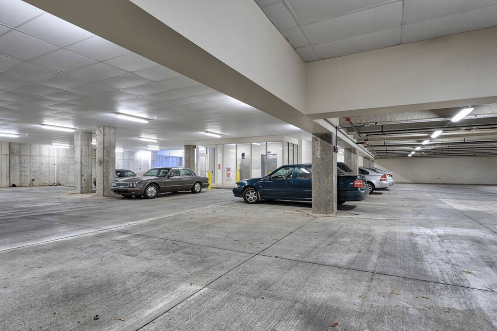 a parking garage with cars parked in it