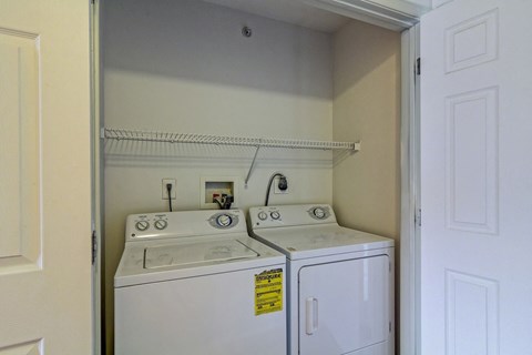 a white washer and dryer in a laundry room