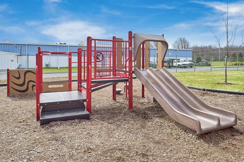 a playground with a slide and other play equipment