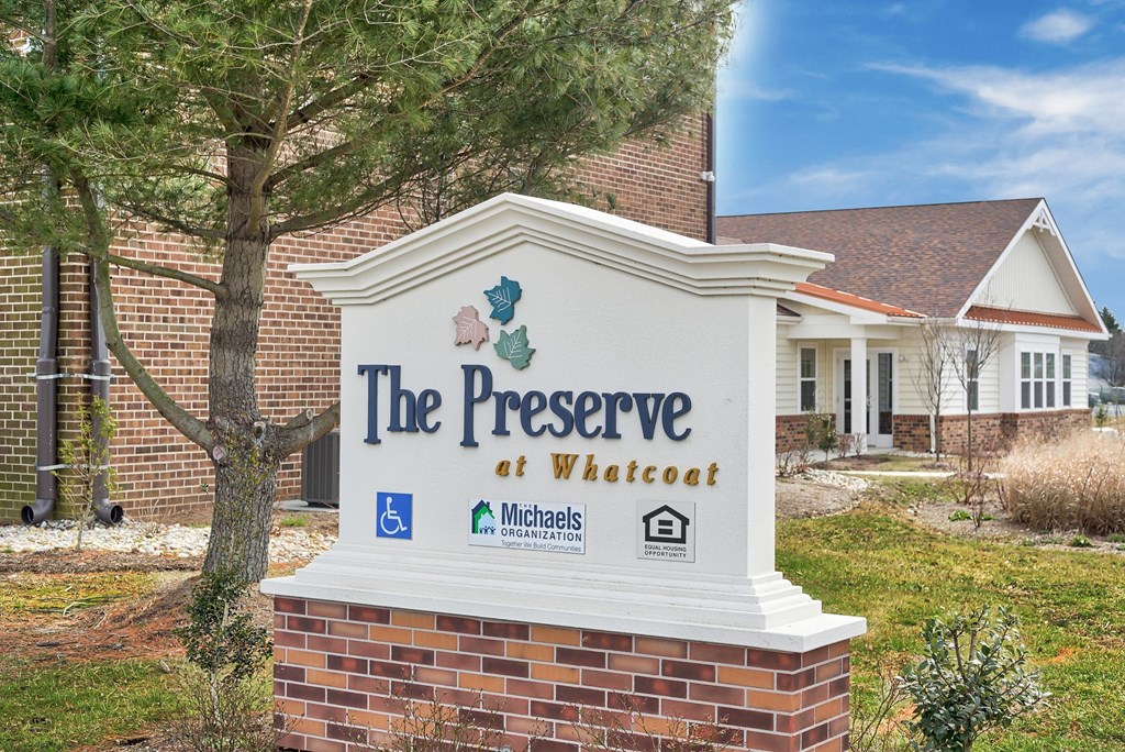 the preserve at wheatland sign in front of a building