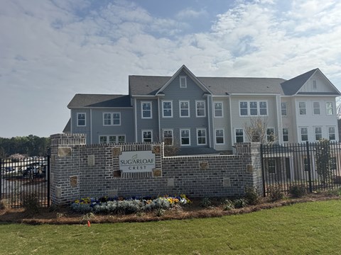 Sugarloaf Crest is a residential building with a sign in front.