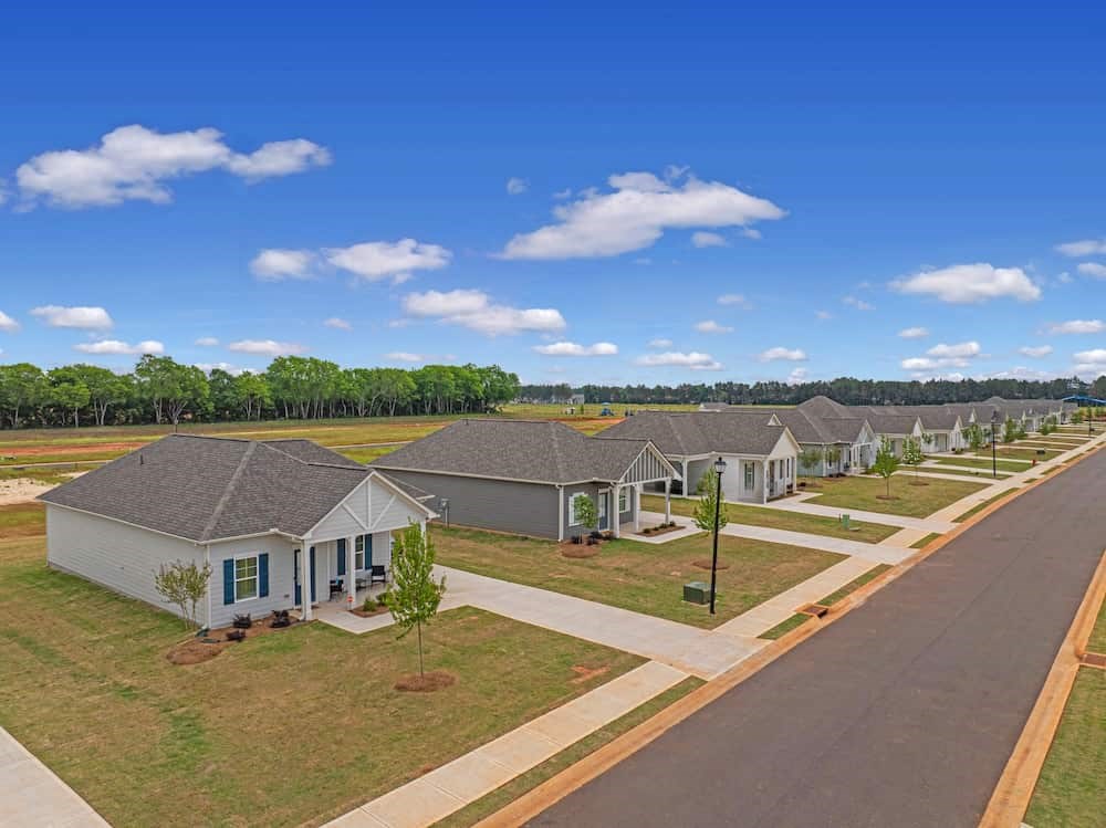 A row of houses with a road in between.