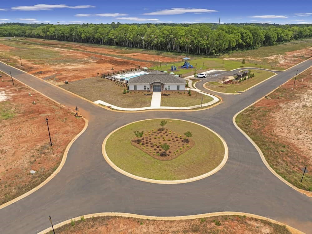 A roundabout with a building in the middle of it.