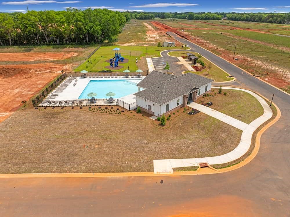 A house with a pool in the backyard.