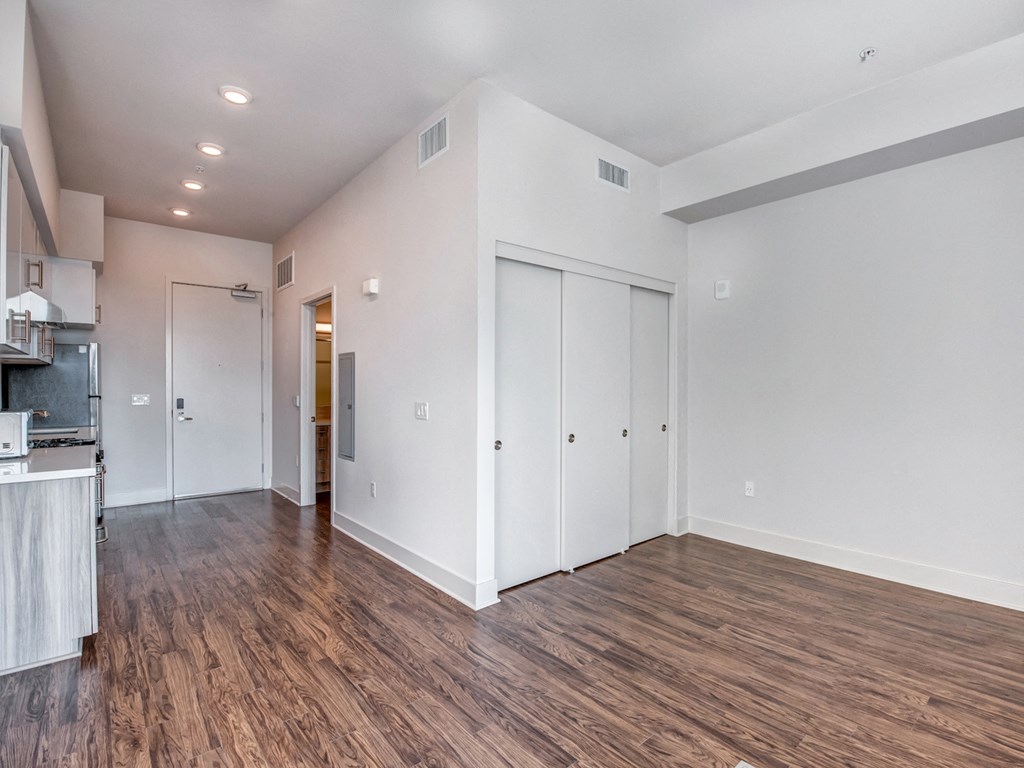 A room with wooden floors and white walls.