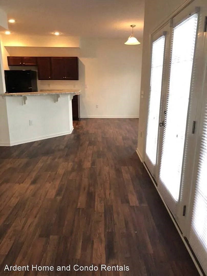 A kitchen area with a counter and cabinets.